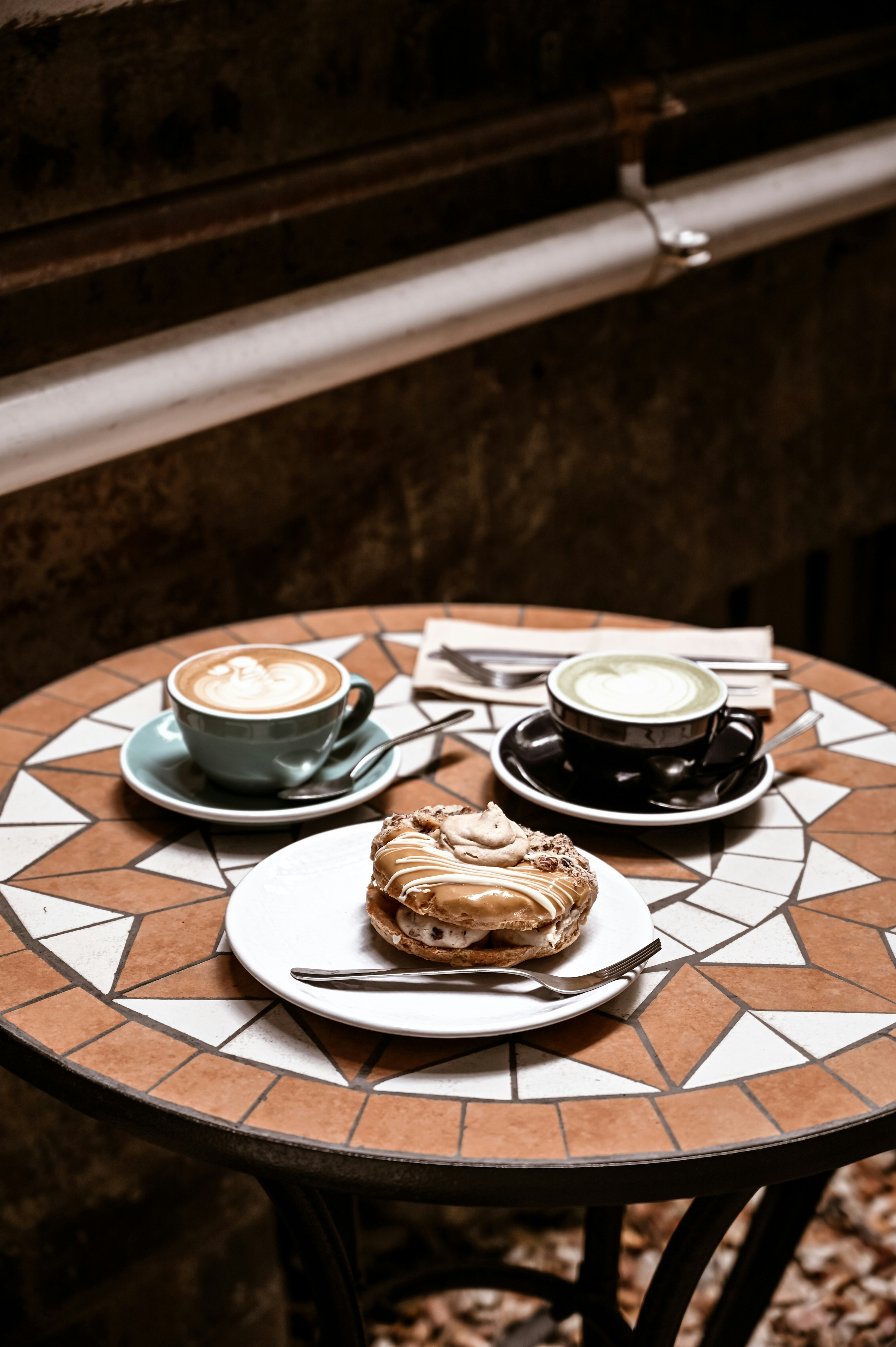 brown and white ceramic plate with brown and white ceramic mug and saucer